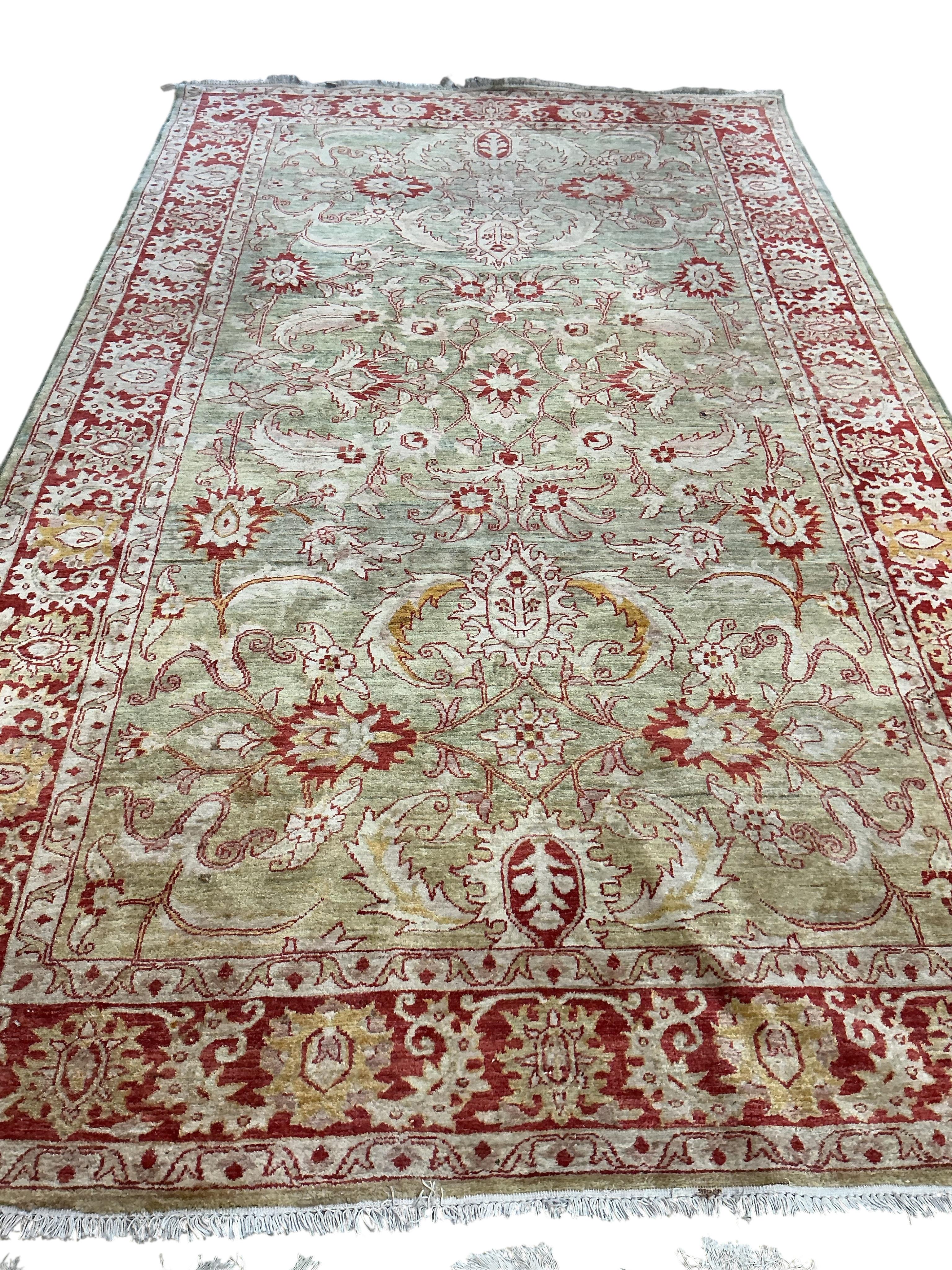 A Zeigler style pale green ground carpet, 340 x 204cm